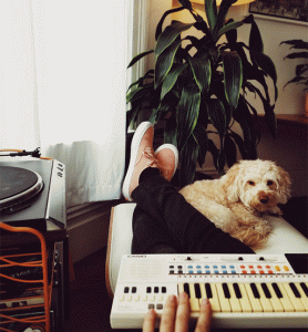 person playing music with dog