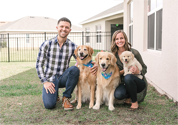 family with golden retriever